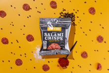 Load image into Gallery viewer, Buck &#39;n&#39; Bird air-dried salami crisps in original flavor, packaged in a silver bag on a yellow background. Scattered salami slices, black peppercorns, and a spoonful of paprika surround the pack, highlighting the snack&#39;s rich taste and keto-friendly, gluten-free qualities.
